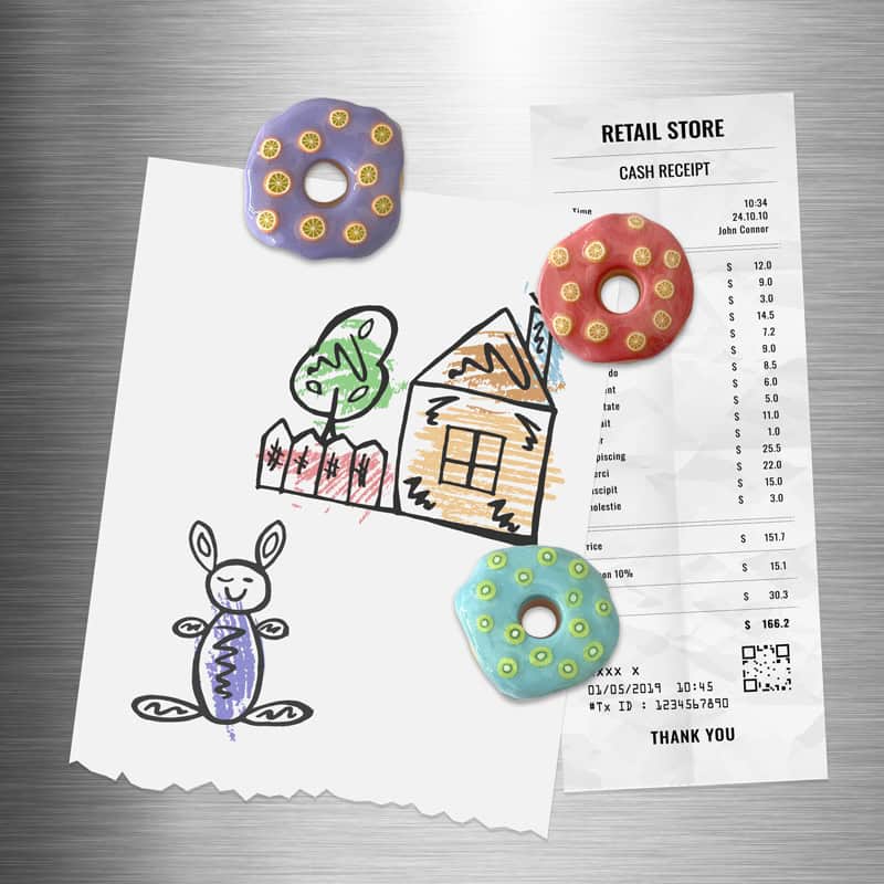 Handmade polymer clay fridge magnets in the shape of donuts